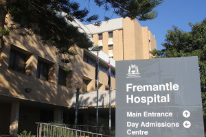 Exterior facade of Fremantle Hospital. A sign reads Fremantle Hospital - Main entrance, day admissions centre